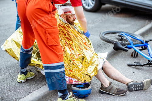 Preview: Medic covering victim with thermal blanket after the accident