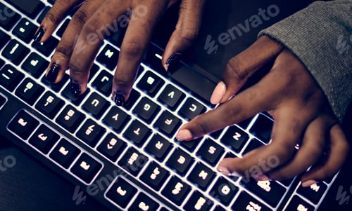 Preview: Closeup of hands working on computer keyboard