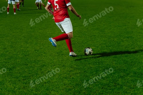 Preview: football player hits ball during football match