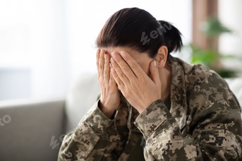 Preview: Military Mental Health. Soldier Female Sitting On Couch, Covering Face In Despair