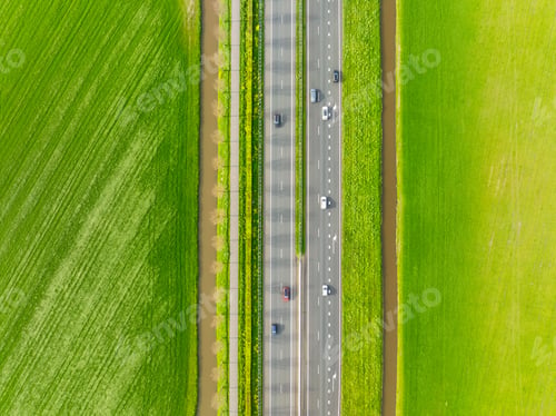 Preview: Drone view of a road in the middle of a field. Landscape from a drone. Road and transport.
