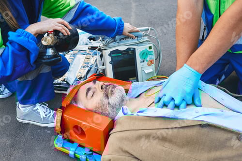 Preview: Paramedics provide first aid to victim man with medical equipment, give heart massage and CPR to