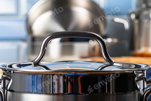 Preview: Set of aluminum cookware on kitchen counter