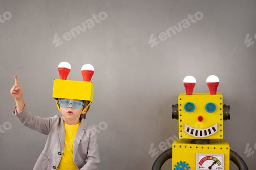 Preview: Happy child playing with robot
