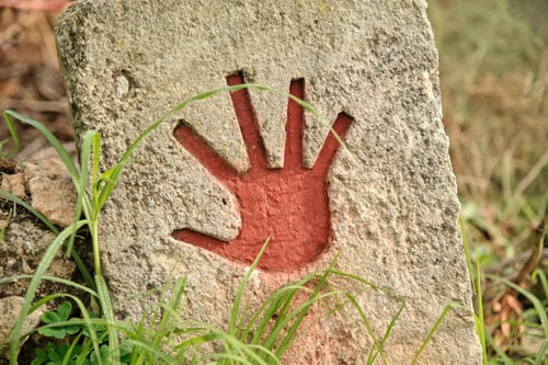 Preview: Red hand print on stone surface