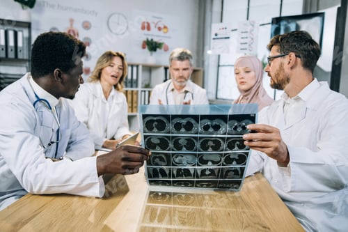Preview: Multiracial doctors cooperating for making diagnosis