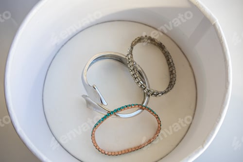 Preview: A set of women's metal bracelets in a jewelry box, top view
