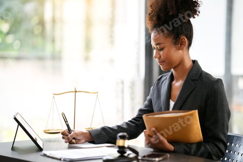 Preview: African american lawyer woman in suit holding envelope of busine