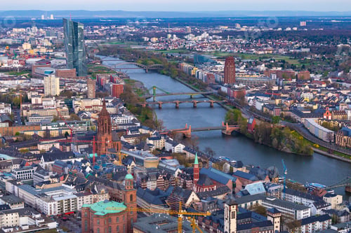 Preview: High angle shot of a cityscape with a river and a lot of buildings in Frankfurt, Germany