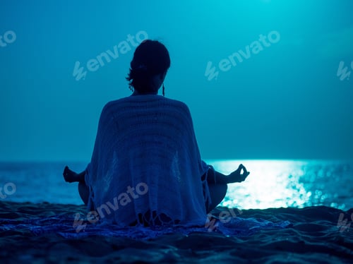 Preview: Woman sitting on beach at night and meditate with hands in gyan mudra on moon road on sea background