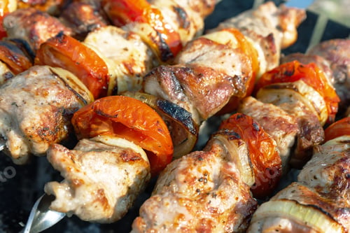 Preview: Grilled fried pork meat, pieces of meat on skewers.