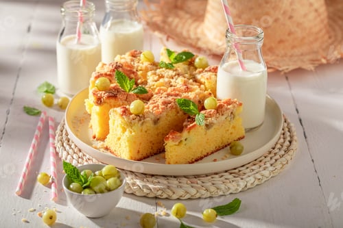 Preview: Delicious gooseberry butter cake served with milk in bottle.