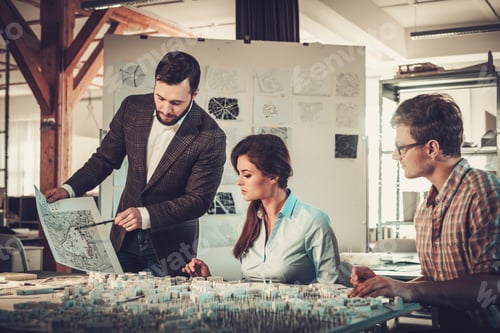 Preview: Confident team of engineers working together in a architect stud