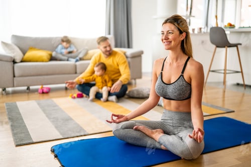 Preview: Young woman is exercising yoga at home. Fitness, workout, healthy living and diet concept