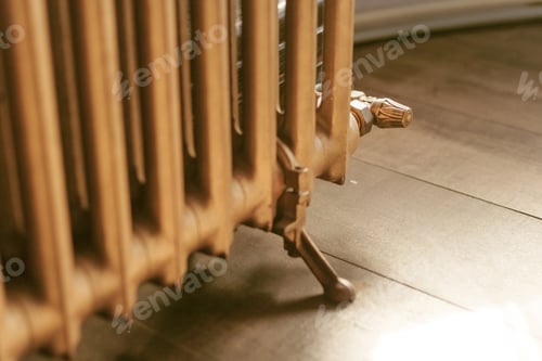 Preview: old vintage heating radiator with valve
