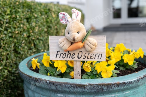 Preview: Sign with a rabbit and the inscription Happy Easter in German.