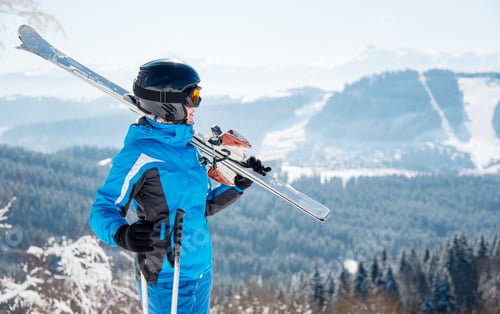 Preview: Skier resting on top of the mountain