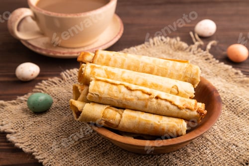 Preview: Waffles with caramel on brown wooden, linen textile, cup of coffee, side view