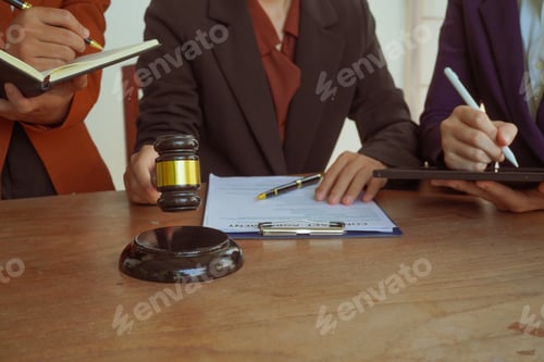 Preview: A group of lawyers and clients engage in a professional meeting law office, discussing agreements