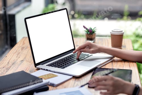 Preview: Close-up of businesswoman hand typing on laptop keyboard while sitting in office with credit card do
