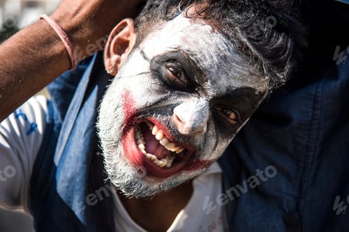 Preview: Close-up portrait of a horrible scary zombie man. Horror. Halloween.