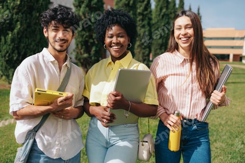 Preview: Portrait of three multiethnic students at college campus.
