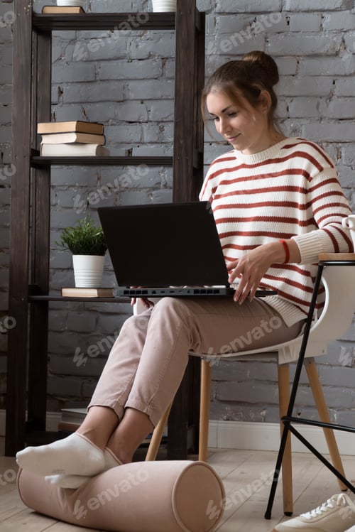 Preview: pretty smiling happy woman work with laptop at home