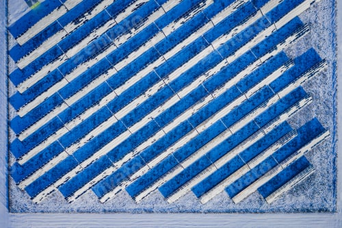 Preview: Winter solar panels and snowy field. Alternative energy in winter
