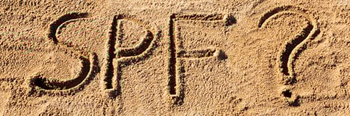 Preview: Sun protect factor concept. SPF word written on the beach with question mark