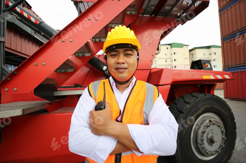 Preview: Foreman control loading Containers box from Cargo freight ship for import export.