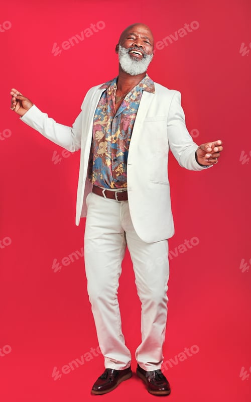 Preview: Studio shot of a man wearing vintage clothes while dancing against a red background