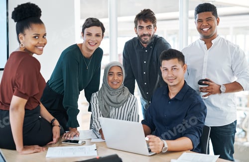 Preview: Shot of a group of businesspeople using a laptop during a meeting in a modern office
