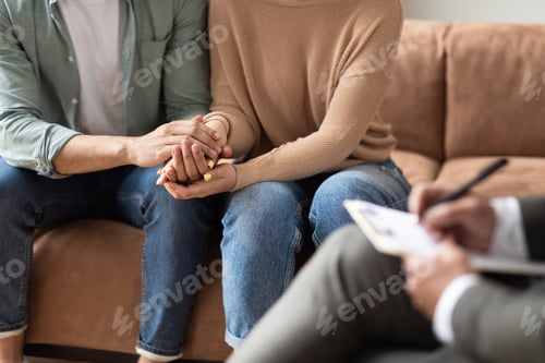 Preview: Couple talking at session with male therapist