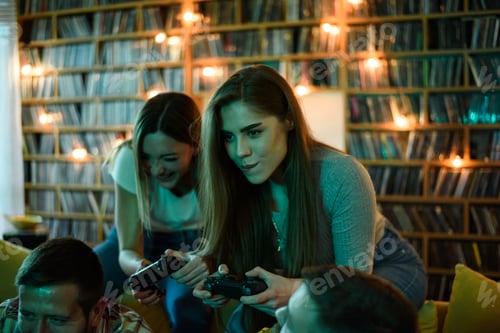 Preview: Two best friends playing video games while relaxing at home