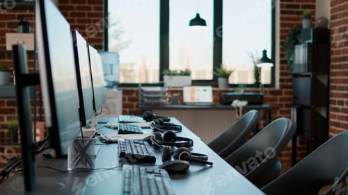 Preview: No people at desk with multiple computers in call center office