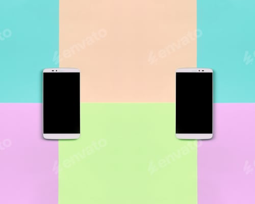 Preview: Two modern smartphones with black screens on background of fas