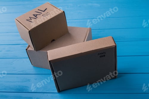Preview: Three unpacked cardboard mail boxes.