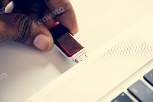 Preview: Hand holding Universal Serial Bus portable data backup