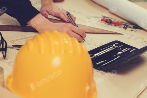 Preview: Architect Drawing Plans And Blue-Prints.