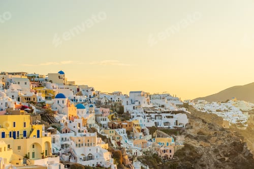 Preview: Picturesque White Buildings on Hillside at Golden Hour