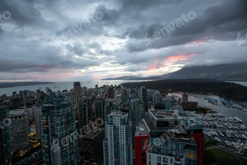 Preview: Aerial view of Downtown City during a stormy summer sunset