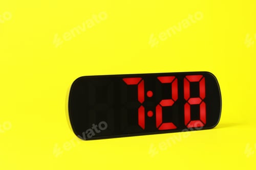 Preview: Digital alarm clock showing 7:28 o'clock on yellow background