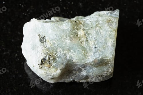 Preview: sample of raw gray labradorite mineral on black
