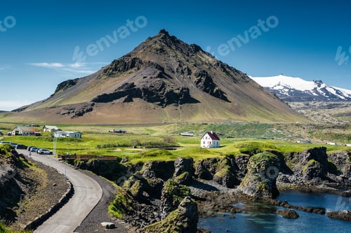 Preview: Arnarstapi fishing village with Stapafell mountain and basalt rocks formation on coastline