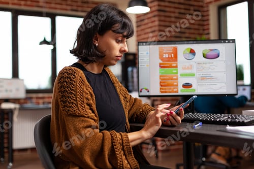 Preview: Businesswoman looking at phone screen reading business email receiving good news