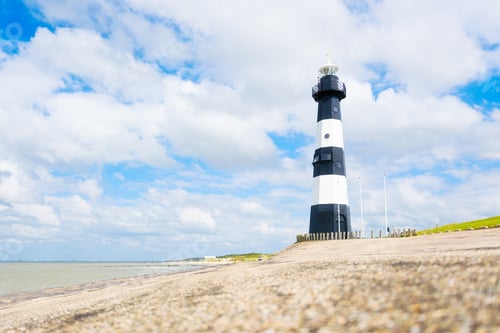 Preview: Sea coast and lighthouse. Lighthouse on the seaward side of the causeway. Sea sign.