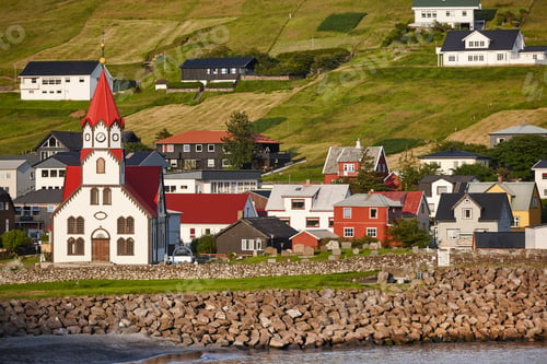 Preview: Sandavagur village with colorful houses church on Faroe islands.