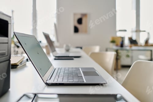 Preview: Laptop In Modern Workplace Interior