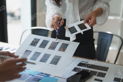Preview: Web designers working on user interface and user experience of mobile application