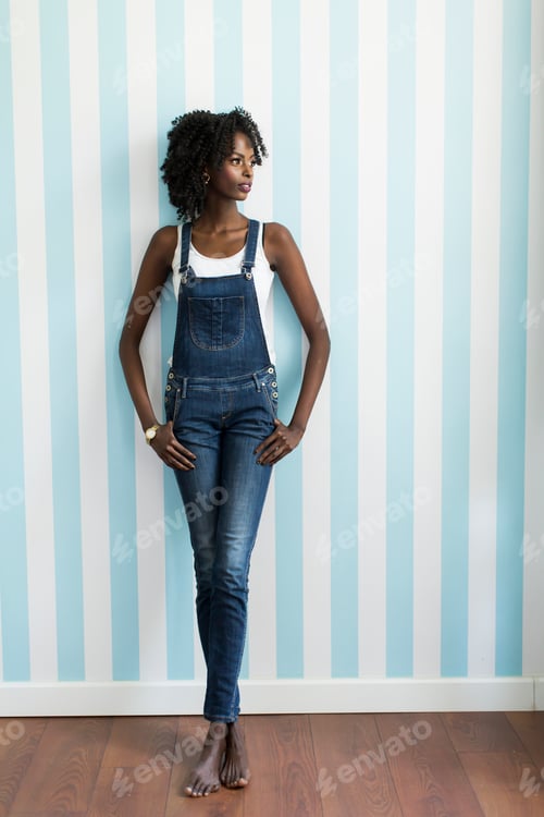 Preview: Woman posing by the wall